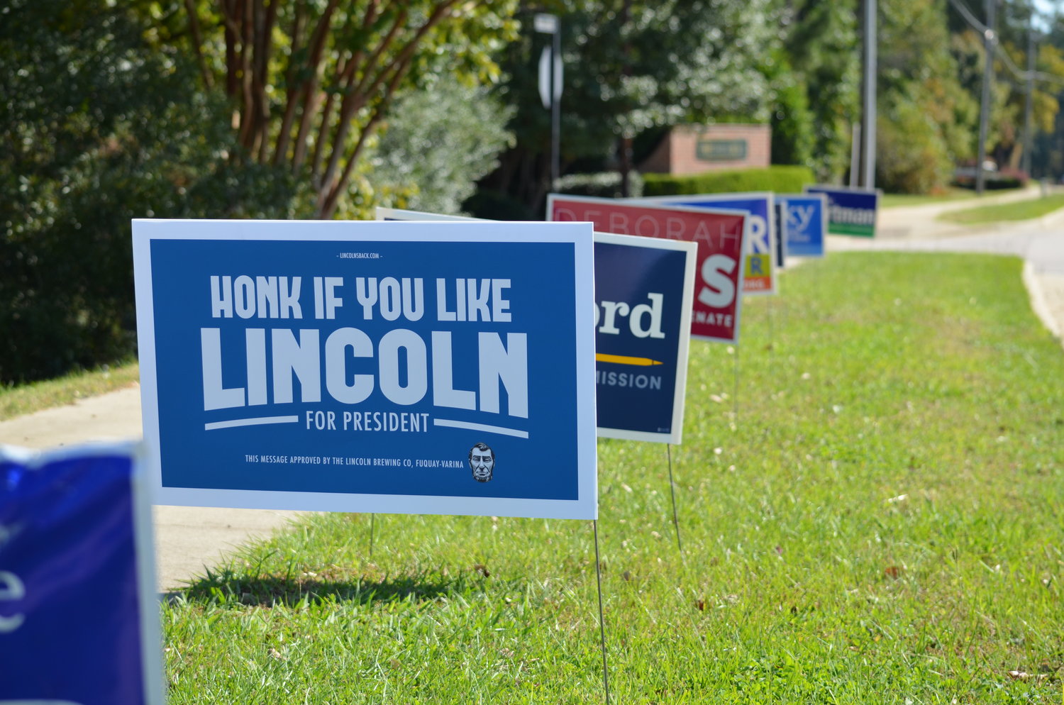 Row of political signs featuring the Lincoln Campaign